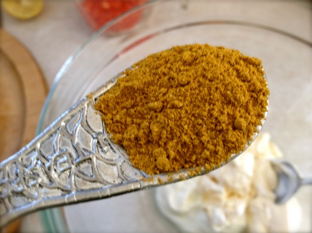 Measuring spoon with curry powder