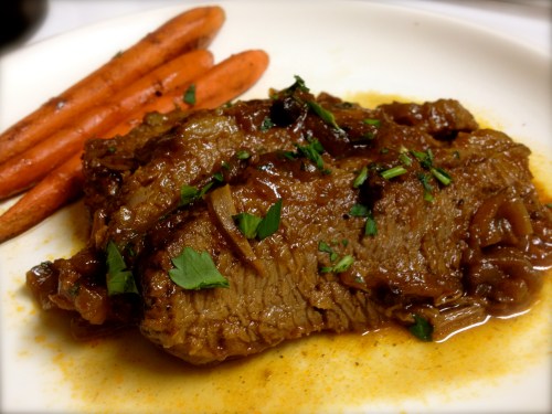 A few slices of sweet and sour brisket with glazed carrots A few slices of sweet and sour brisket with glazed carrots