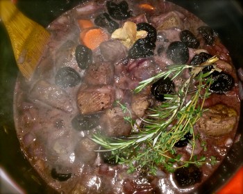 Adding the flavor enhancer - prunes, herbs, cinnamon and cloves