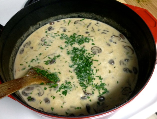 Finishing the soup with cream and some fresh parsley