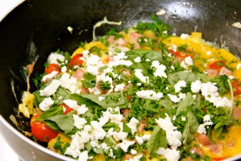 Adding crumbled Feta cheese and fresh herbs