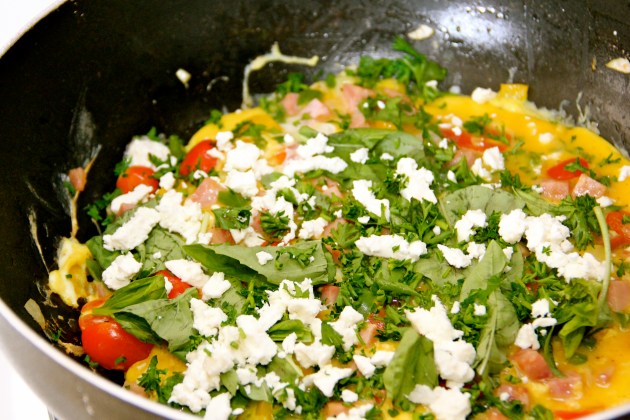 Adding crumbled Feta cheese and fresh herbs