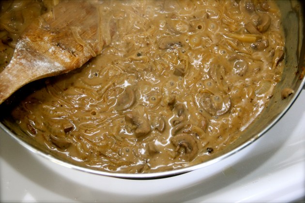 Wine and sour cream added. Simmering