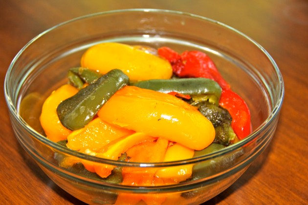 Peeled peppers are resting in a bowl