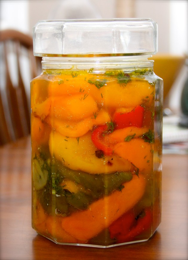 Marinated roasted bell peppers in a jar