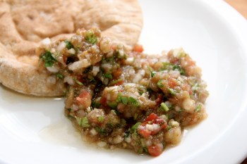 Enjoying the eggplant caviar with pita bread
