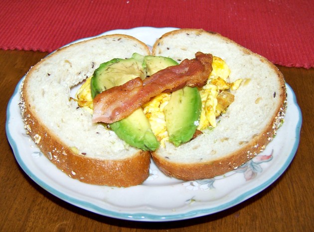 A Valentine's Day breakfast -- a heart shaped toast stuffed with eggs and avocado, with bacon for an arrow A Valentine's Day breakfast -- a heart shaped toast stuffed with eggs and avocado, with bacon for an arrow