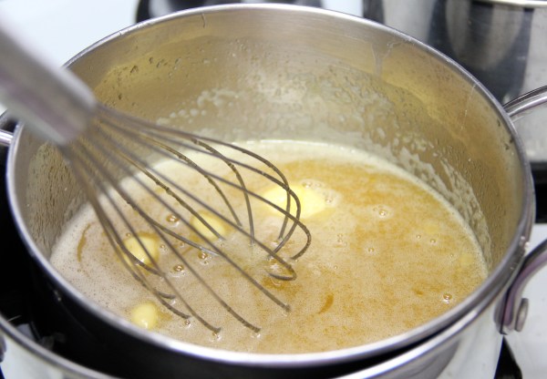 Improvised double-boiler. Whisking eggs, butter, honey and sugar