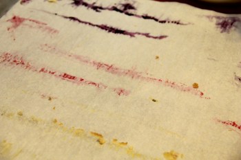 Fruit juice streaks on the parchment.