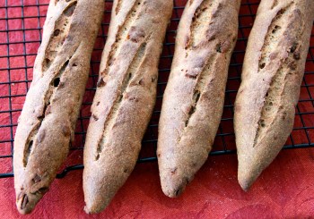Freshly backed rye baguettes with bacon