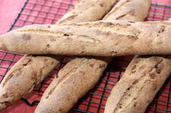 Freshly backed rye baguettes with bacon