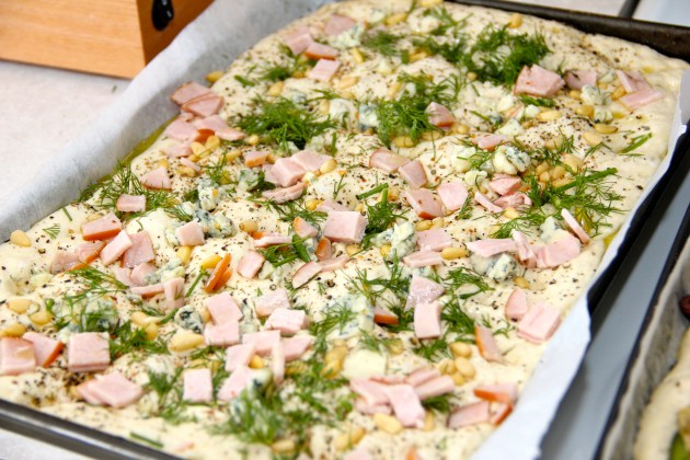 Final rise of the ham, blue cheese and pine nuts focaccia