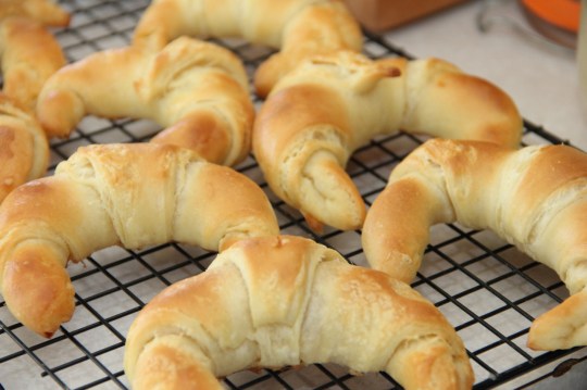 Sourdough Croissants resting on a rack