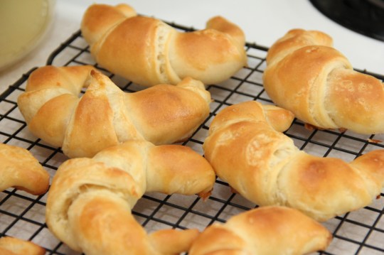 Sourdough Croissants resting on a rack