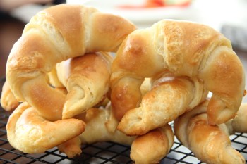 A herd of freshly baked Sourdough Croissants