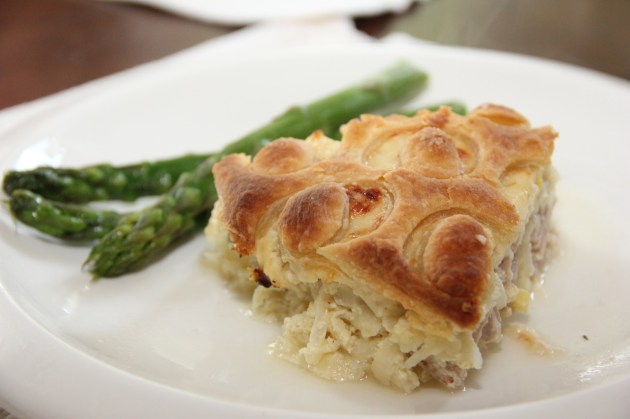 A slice of White Onion & Tuna Tart