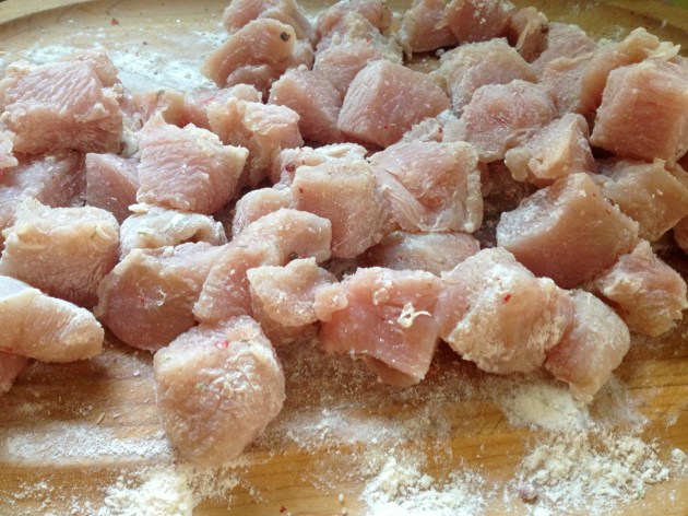 Turkey thigh cut into 1" pieces and drenched in flour