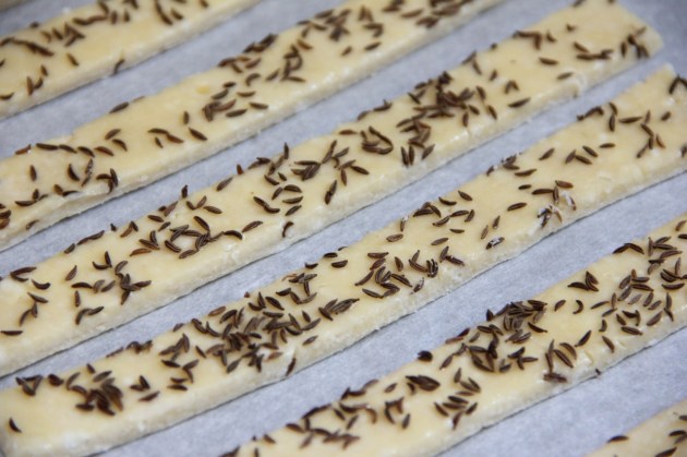 Cheese Sticks With Caraway Seed -- cutting into strips