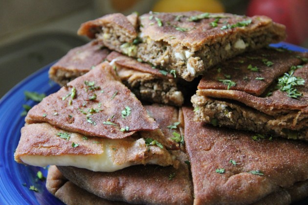 Freshly made plăcintă pies served on a plate